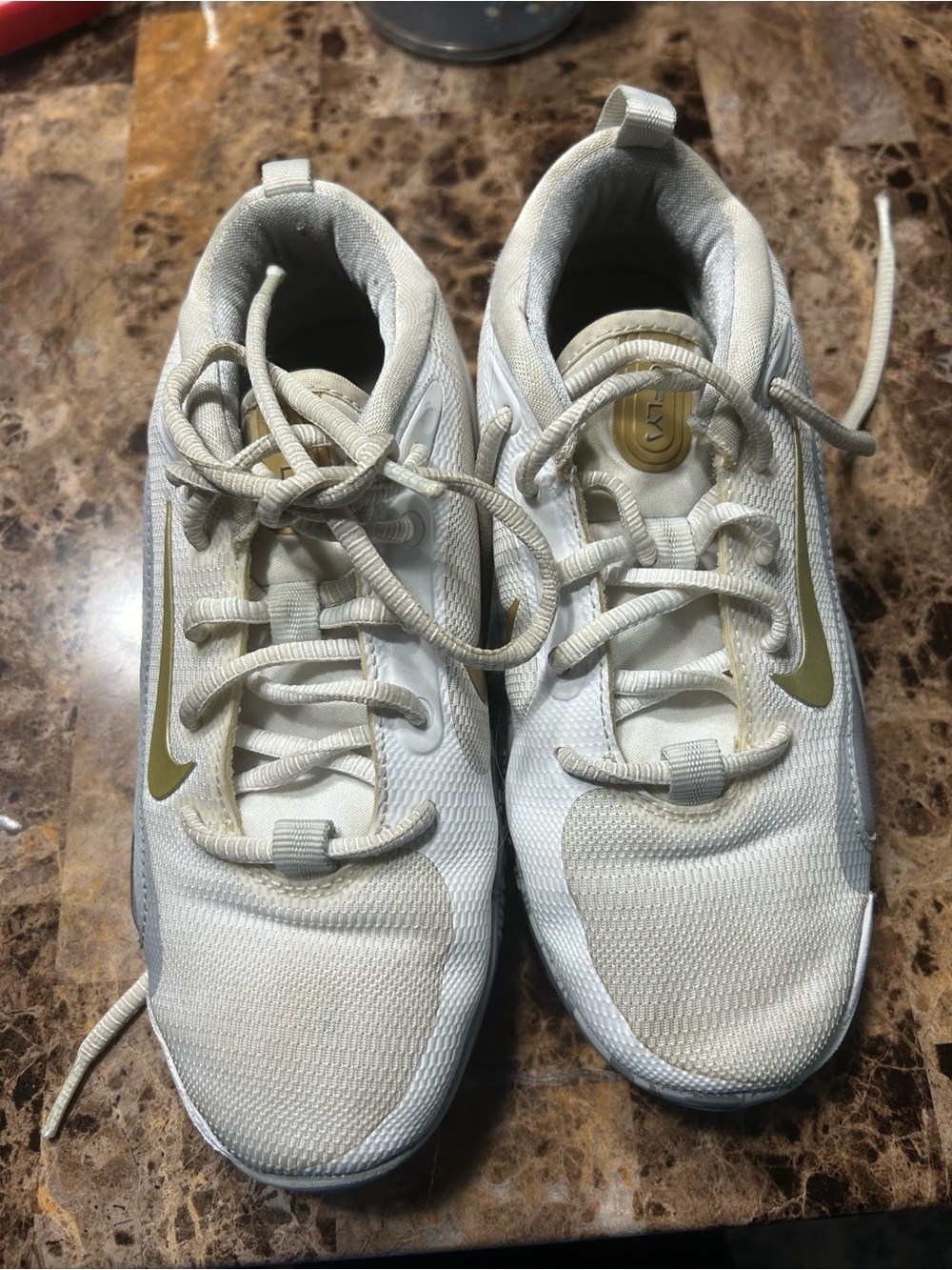Nike Kids White Sneakers with Gold Swoosh